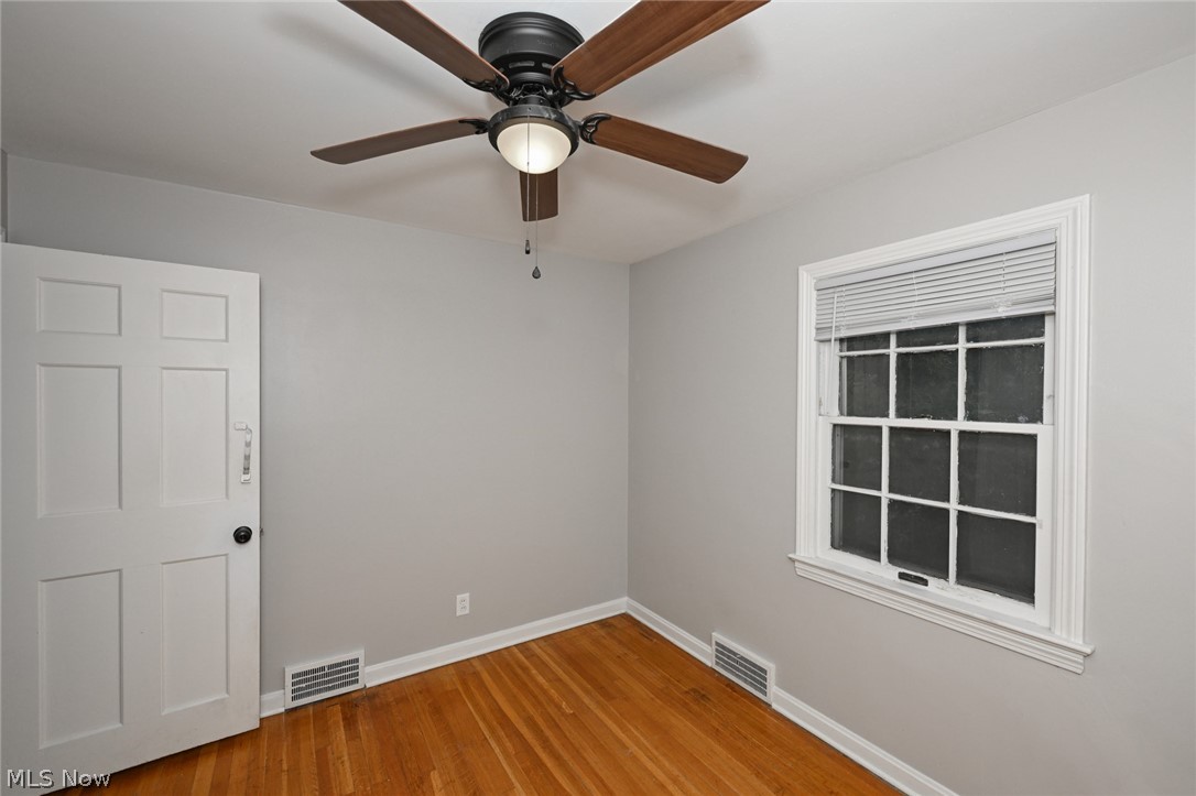 3699 Bainbridge Road Cleveland Heights, OH 44118 - Photo 20 of 37 Wood-finish flooring with light gray walls