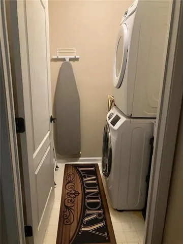 a utility room with mirror and vanity