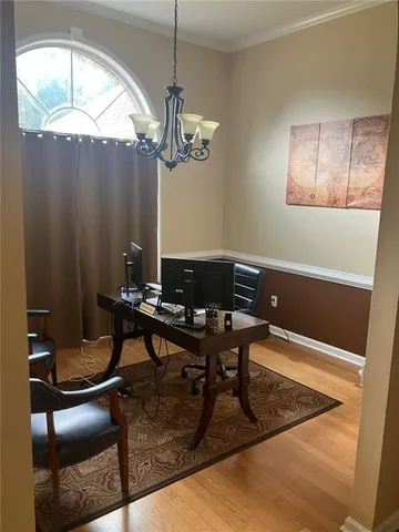 a view of a livingroom with furniture and a chandelier