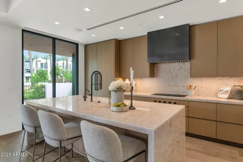 a kitchen with a stove a sink and a refrigerator