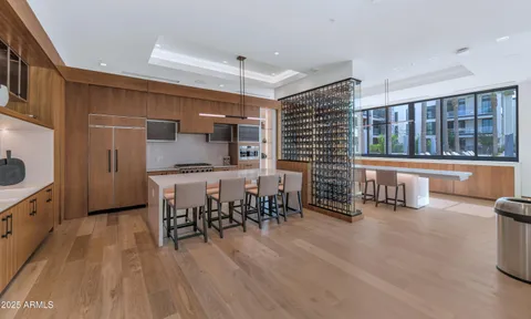 a dining room with furniture and a wooden floor