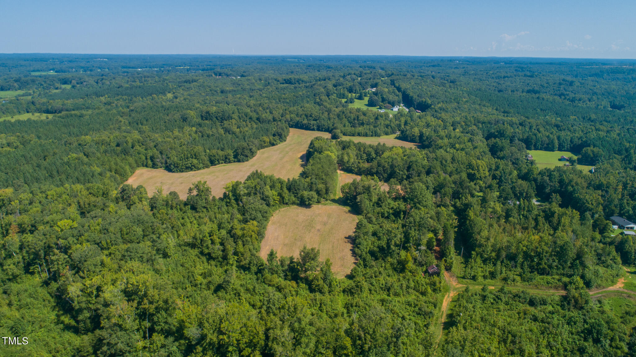 121-acres Medford Oakley Road Rougemont, NC 27572 - Photo 4 of 14 an aerial view of a house with a yard and lake view