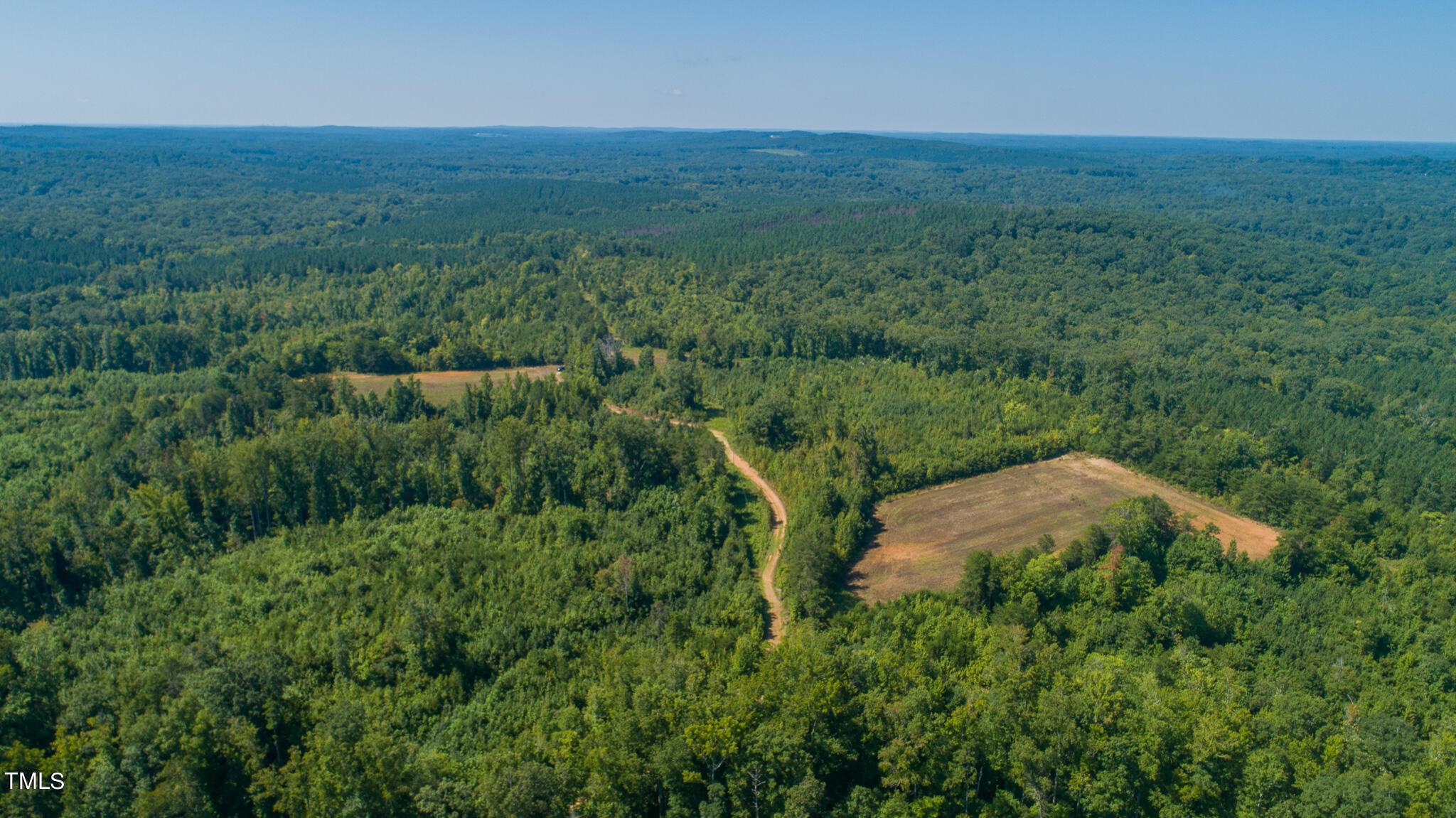 121-acres Medford Oakley Road Rougemont, NC 27572 - Photo 5 of 14 an aerial view of a house with a yard