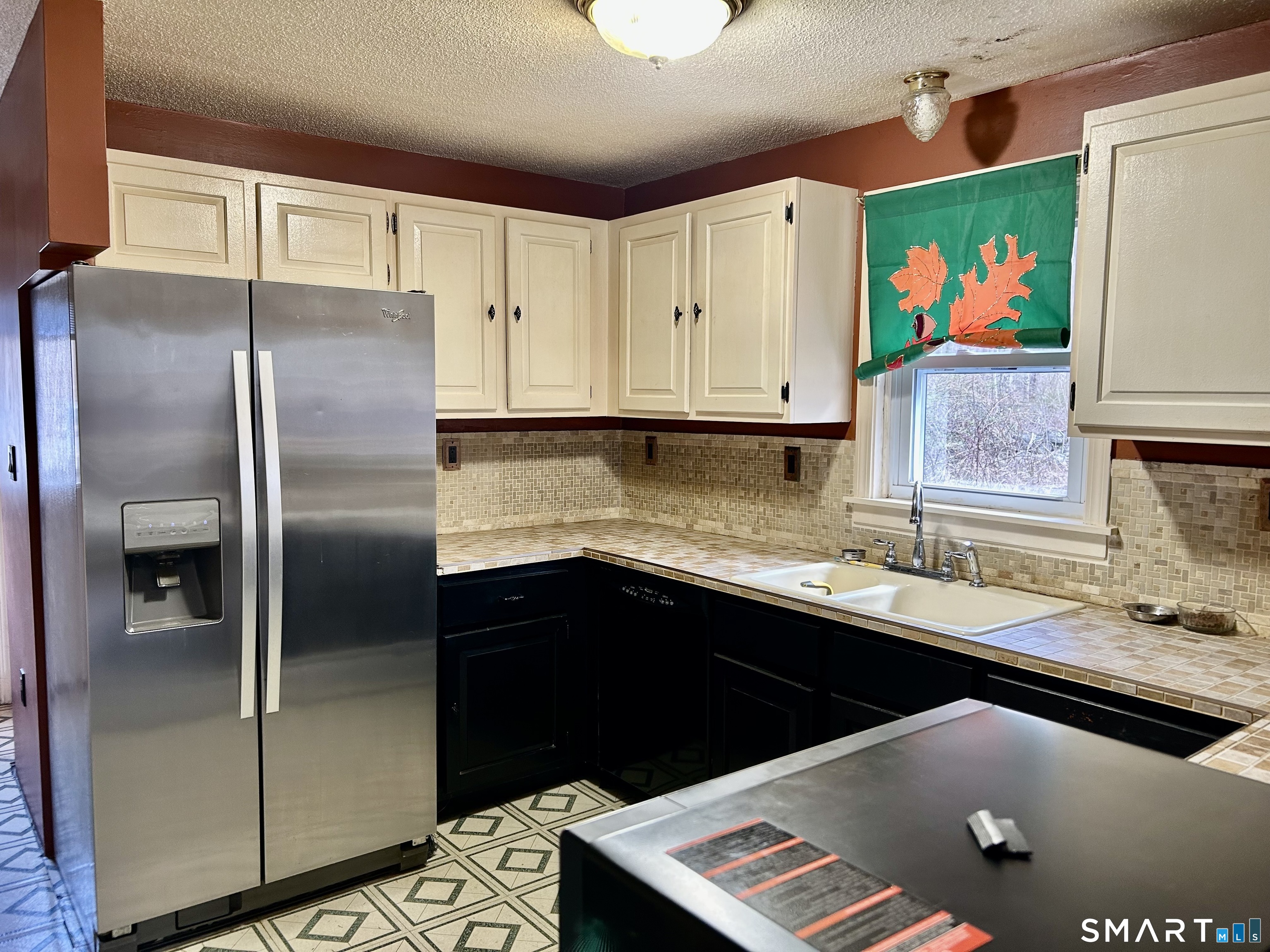 222 Parish Hill Road Scotland, CT 06264 - Photo 4 of 14 a kitchen with stainless steel appliances granite countertop a refrigerator and a sink
