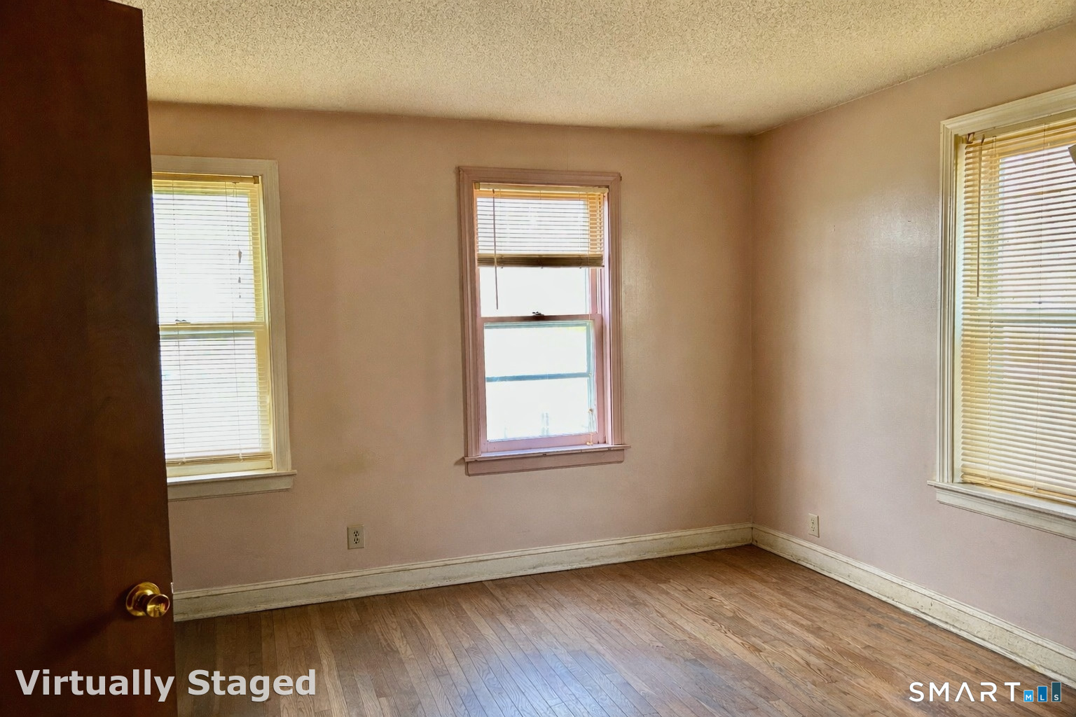 222 Parish Hill Road Scotland, CT 06264 - Photo 5 of 14 a view of an empty room with wooden floor and a window
