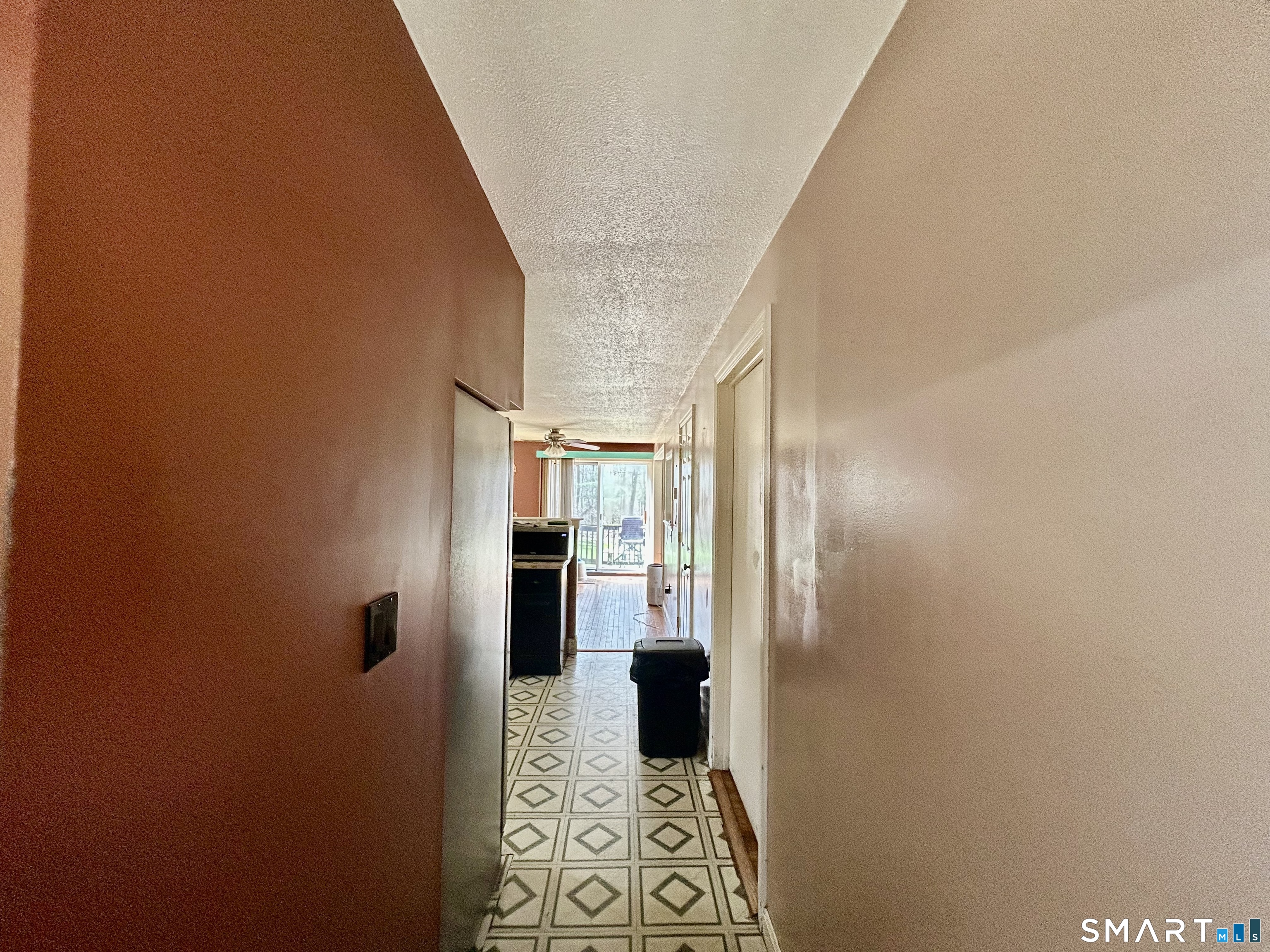 222 Parish Hill Road Scotland, CT 06264 - Photo 6 of 14 a view of a hallway with wooden shelves