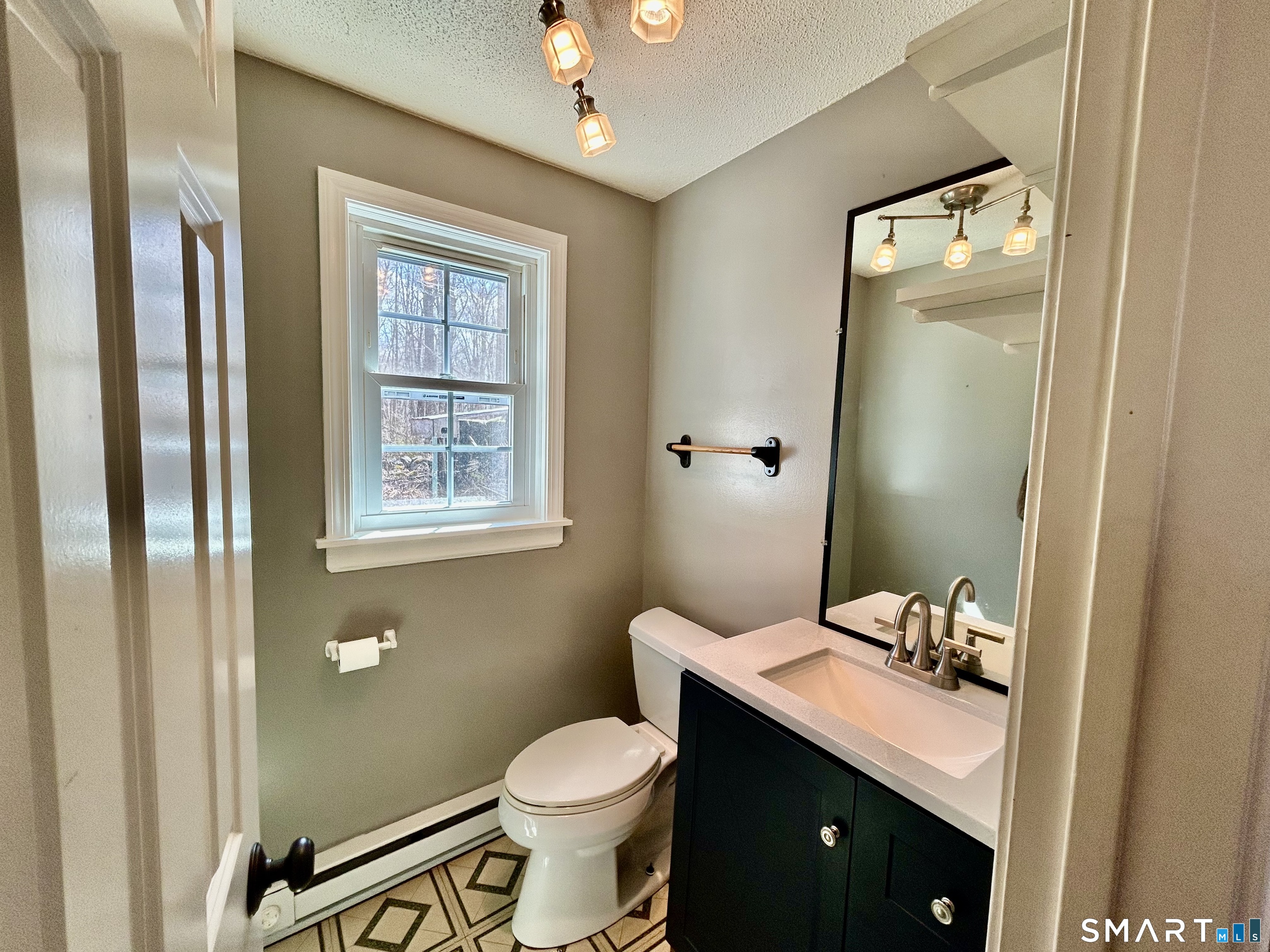 222 Parish Hill Road Scotland, CT 06264 - Photo 7 of 14 a bathroom with a granite countertop sink toilet and shower