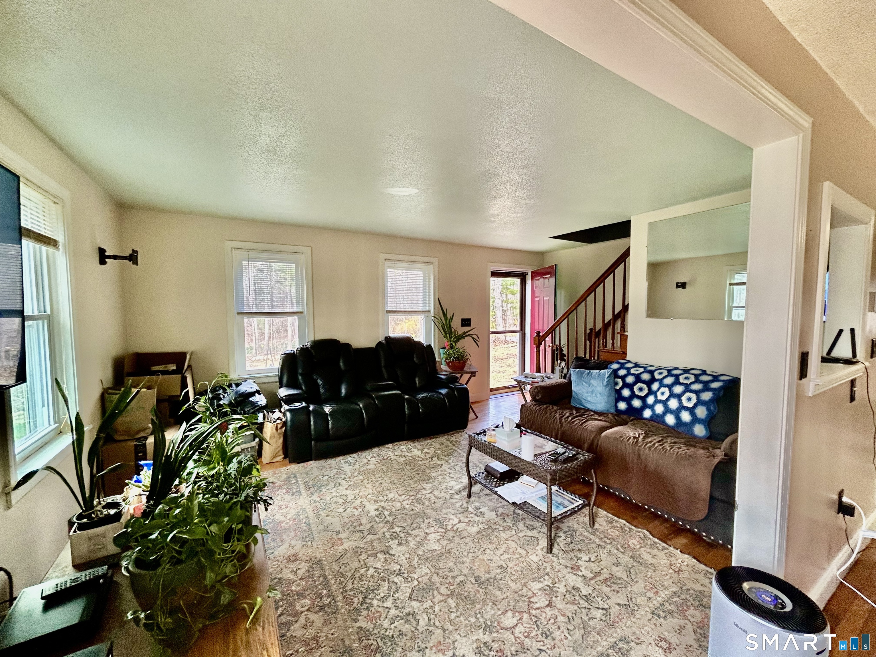 222 Parish Hill Road Scotland, CT 06264 - Photo 8 of 14 a living room with furniture ceiling fan and a rug