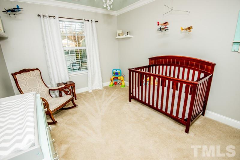 422 Plainview Avenue Raleigh, NC 27604 - Photo 18 of 25 a bedroom with furniture and a window