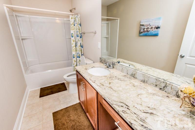 422 Plainview Avenue Raleigh, NC 27604 - Photo 20 of 25 a bathroom with a bathtub and a sink