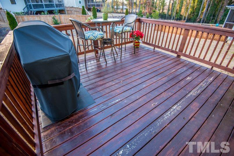 422 Plainview Avenue Raleigh, NC 27604 - Photo 23 of 25 a balcony with wooden floor table and chairs
