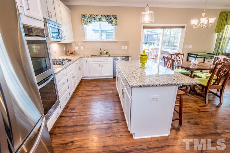 422 Plainview Avenue Raleigh, NC 27604 - Photo 5 of 25 a kitchen with stainless steel appliances granite countertop lots of counter top space and furniture