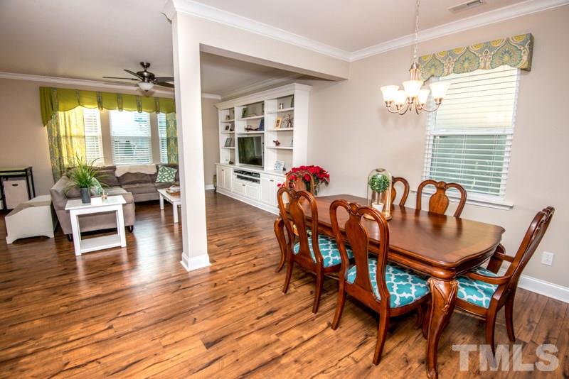 422 Plainview Avenue Raleigh, NC 27604 - Photo 6 of 25 a view of a dining room with furniture and wooden floor
