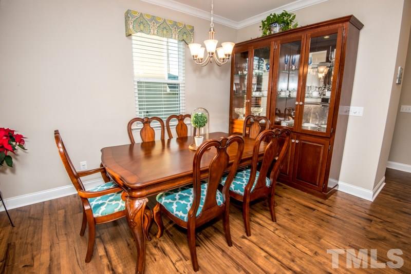 422 Plainview Avenue Raleigh, NC 27604 - Photo 7 of 25 a dining room with furniture and wooden floor