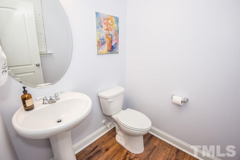 422 Plainview Avenue Raleigh, NC 27604 - Photo 10 of 25 a bathroom with a toilet sink and mirror