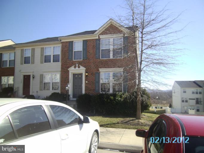 1322 Steed Street Ranson, WV 25438 - Photo 3 of 29 a view of a brick house with many windows