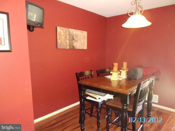 1322 Steed Street Ranson, WV 25438 - Photo 4 of 29 a view of a dining room with furniture and wooden floor