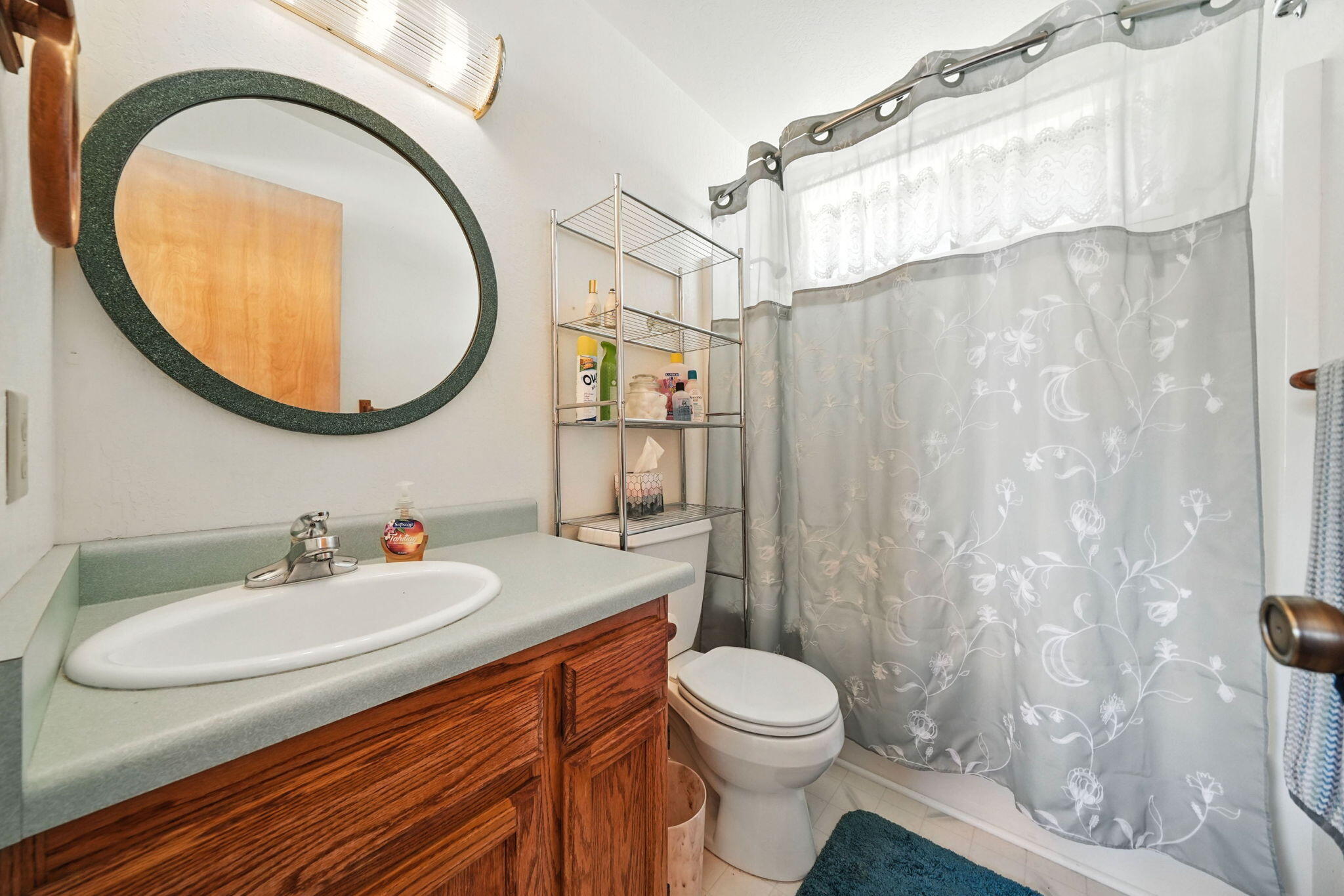 10750 Dixie Road Red Bluff, CA 96080 - Photo 30 of 75 a bathroom with a sink a toilet and a mirror