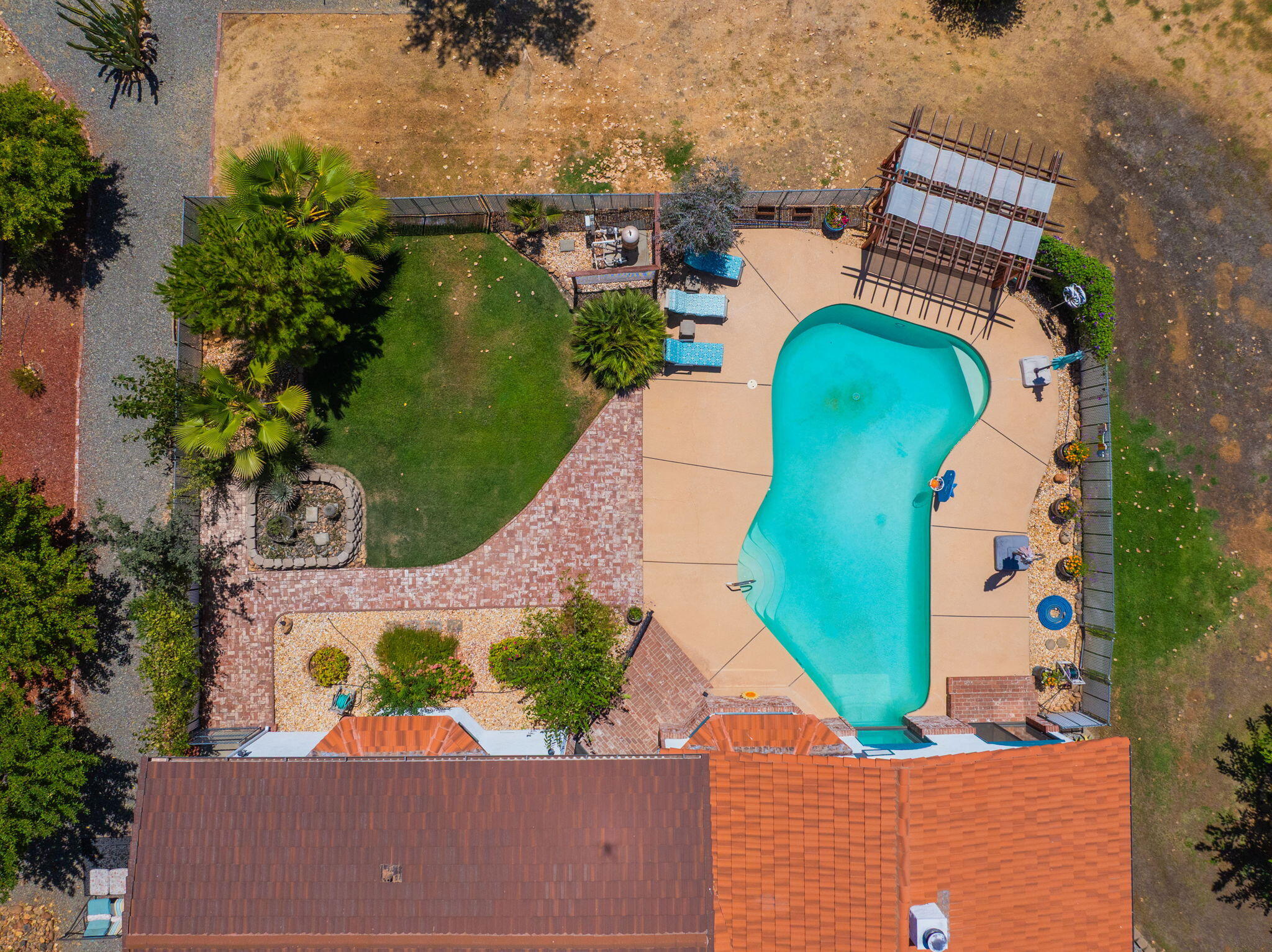 10750 Dixie Road Red Bluff, CA 96080 - Photo 72 of 75 an aerial view of a house with outdoor space swimming pool and tennis court