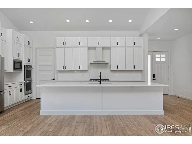 a view of kitchen with wooden floor