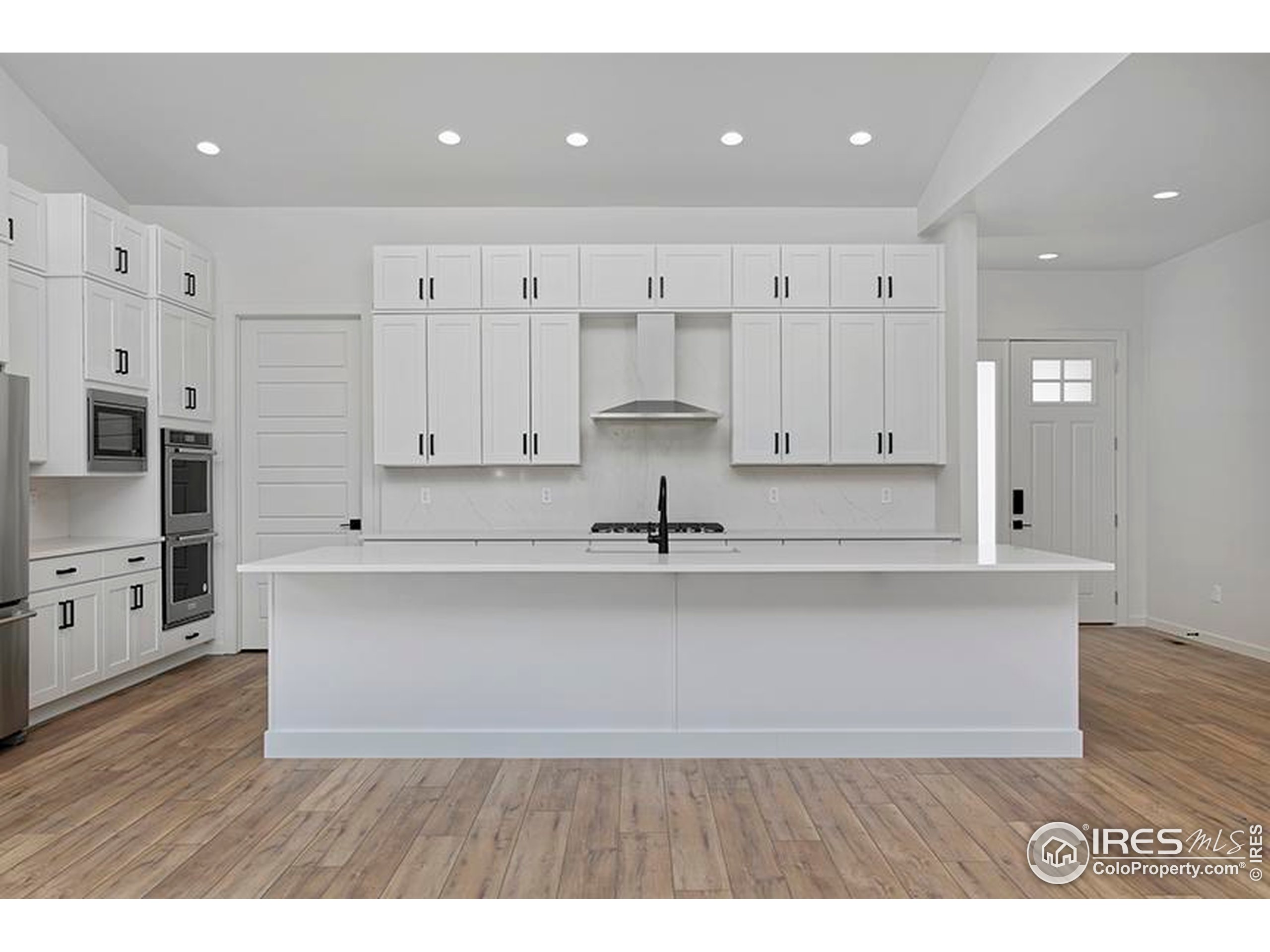 1738 Morningstar Way Fort Collins, CO 80524 - Photo 15 of 49 a view of kitchen with wooden floor