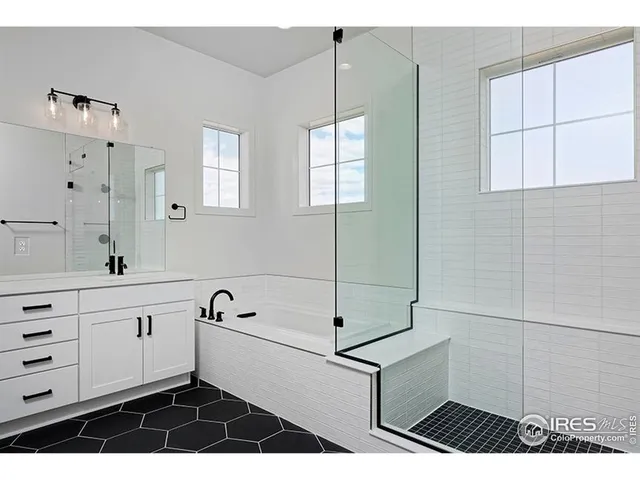 a bathroom with a bathtub and shower