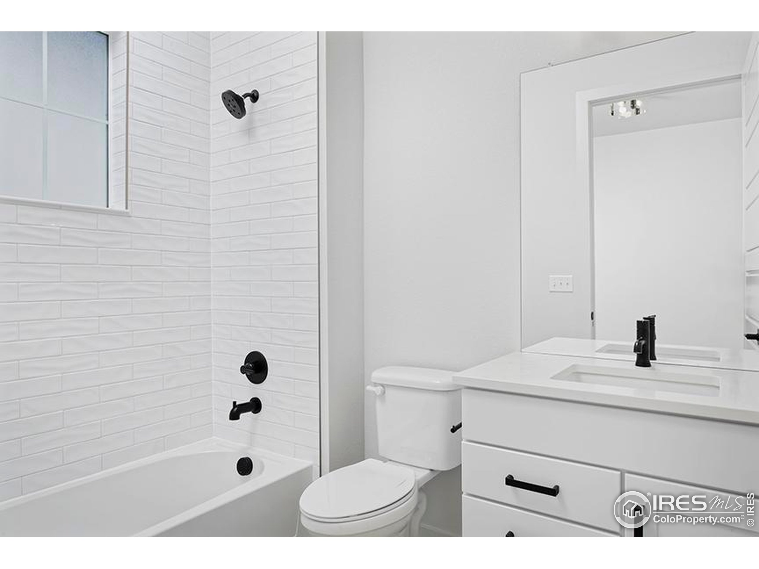 1738 Morningstar Way Fort Collins, CO 80524 - Photo 27 of 49 a bathroom with a sink a toilet and shower