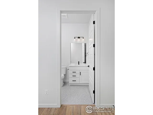 a view of an empty room with windows