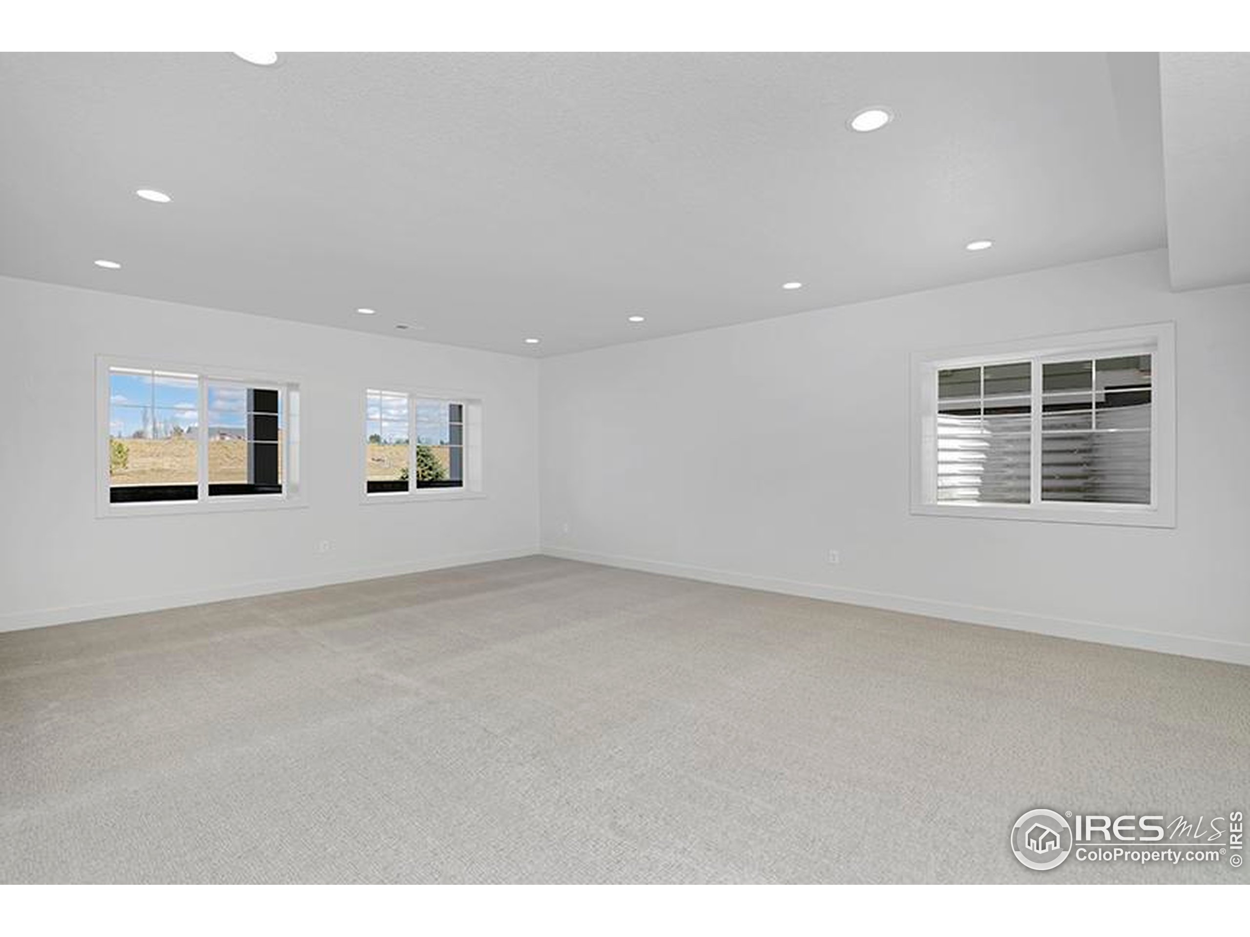 1738 Morningstar Way Fort Collins, CO 80524 - Photo 30 of 49 a view of an empty room with windows