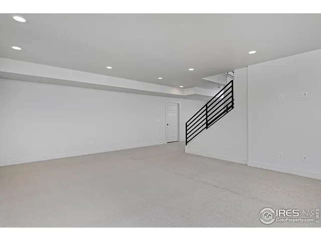 a white toilet sitting next to a bath tub and a shower
