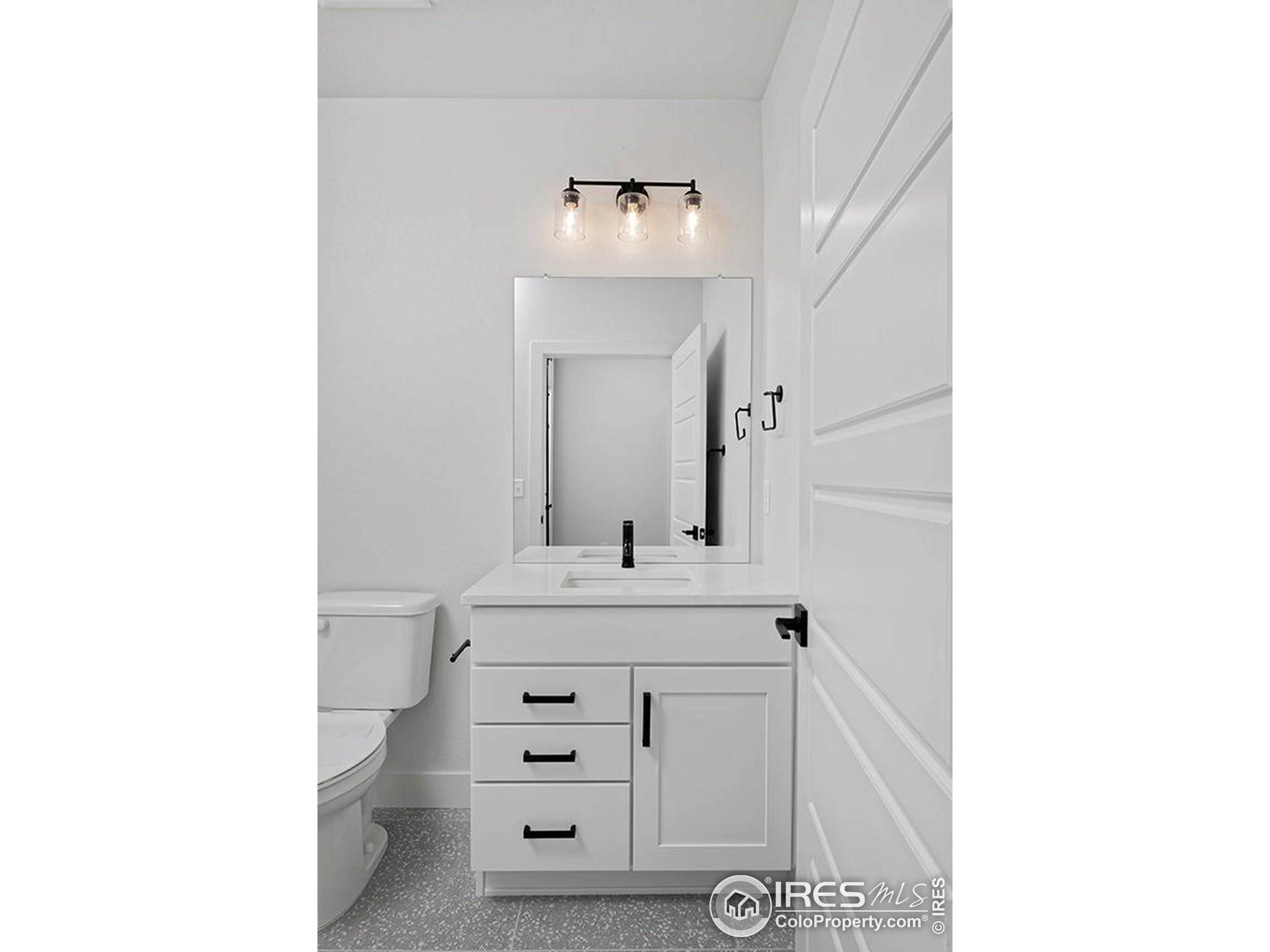 1738 Morningstar Way Fort Collins, CO 80524 - Photo 40 of 49 a bathroom with a sink and a mirror