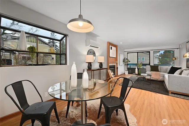 a view of a dining room with furniture and chandelier