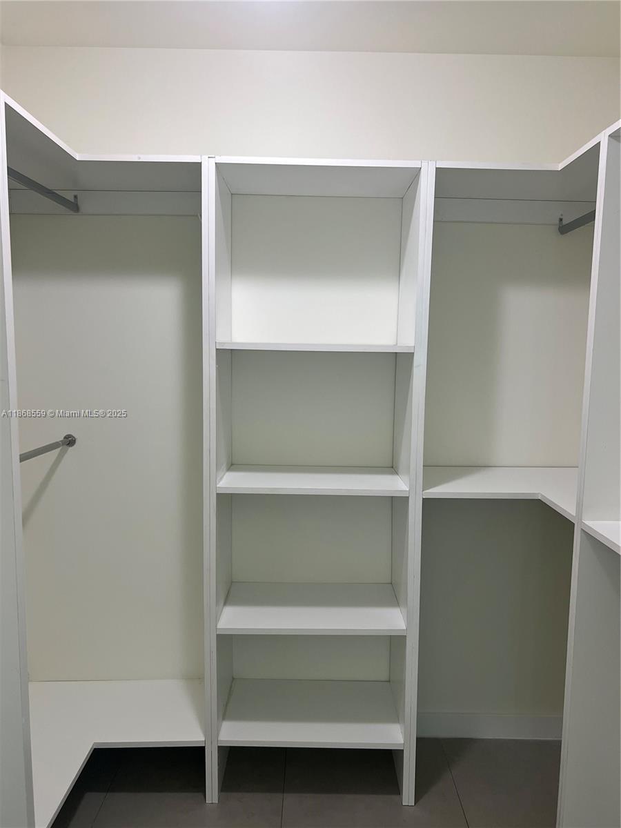 729 Northwest 2nd Street, Unit 1225 Miami, FL 33128 - Photo 12 of 18 a view of an empty walk in closet