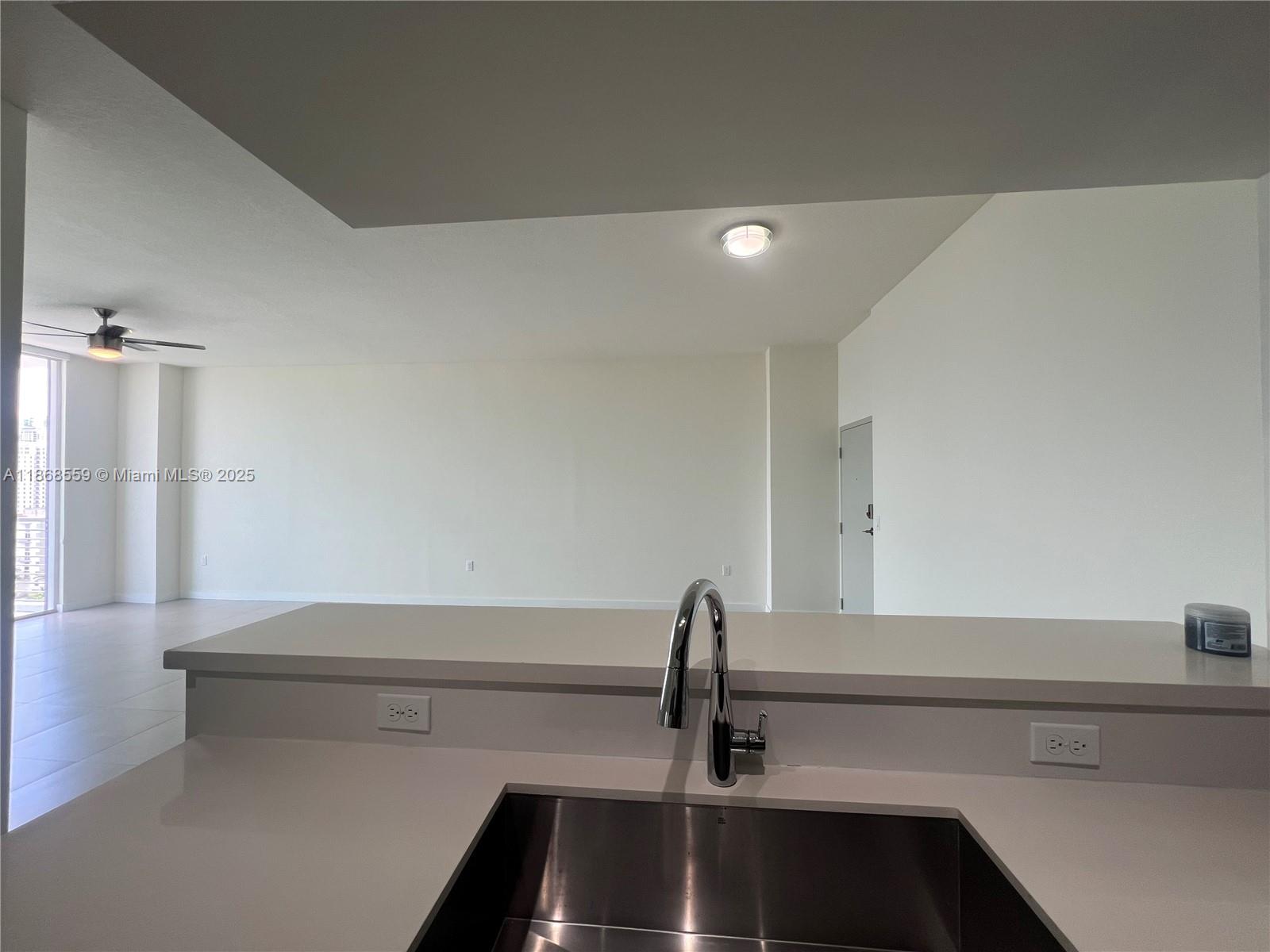 729 Northwest 2nd Street, Unit 1225 Miami, FL 33128 - Photo 3 of 18 a bathroom with a sink and a shower