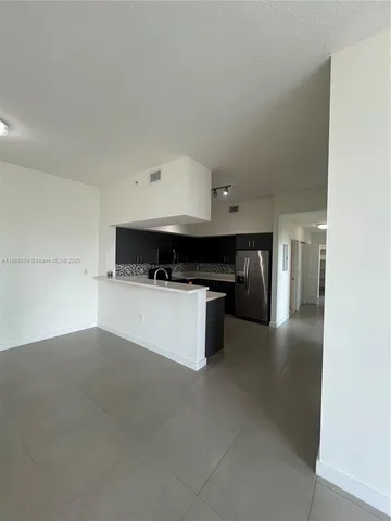 a kitchen with a stove and a refrigerator