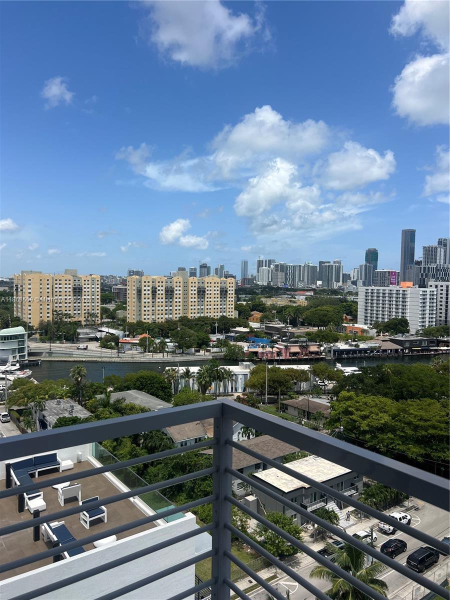 729 Northwest 2nd Street, Unit 1225 Miami, FL 33128 - Photo 9 of 18 a city view from a balcony