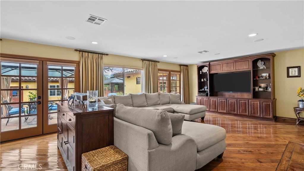 24604 Apple Street Newhall, CA 91321 - Photo 12 of 47 a living room with furniture and a flat screen tv