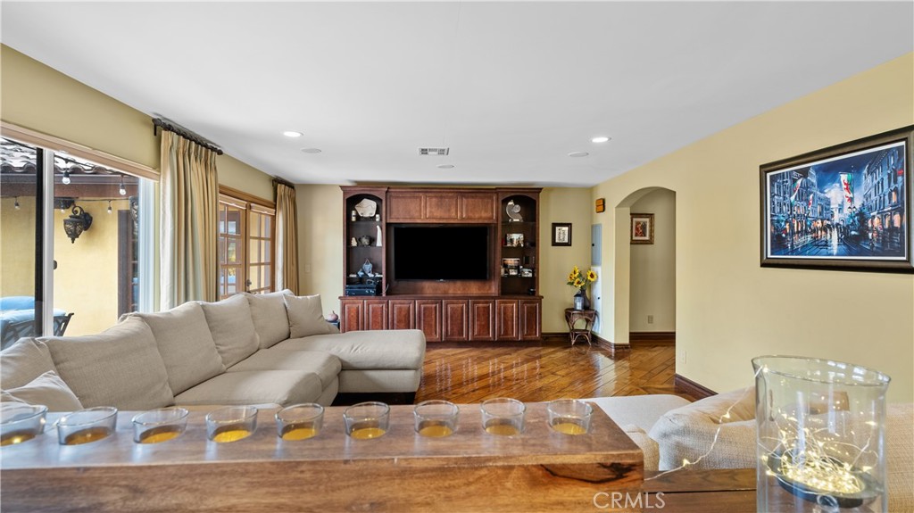 24604 Apple Street Newhall, CA 91321 - Photo 16 of 47 a living room with furniture and a flat screen tv