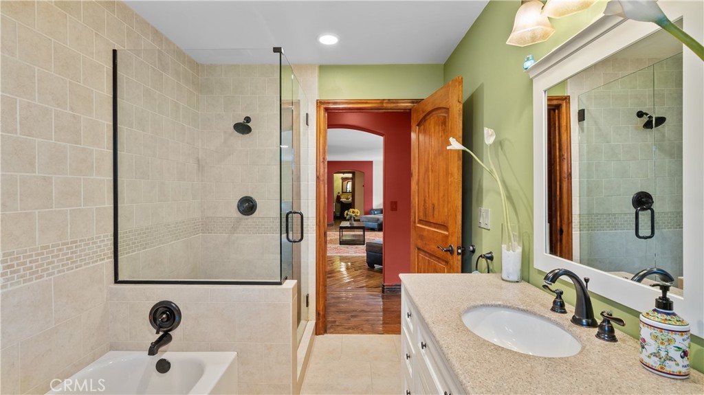24604 Apple Street Newhall, CA 91321 - Photo 24 of 47 a bathroom with a tub sink and mirror