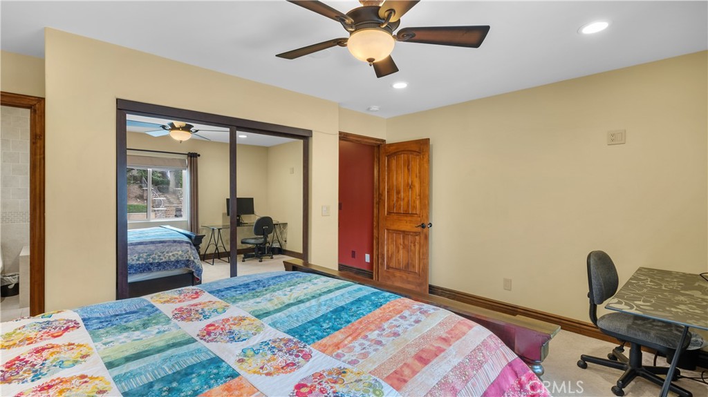 24604 Apple Street Newhall, CA 91321 - Photo 26 of 47 a bedroom with a bed and a chair in it