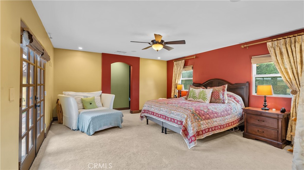 24604 Apple Street Newhall, CA 91321 - Photo 33 of 47 a bedroom with a bed and a chandelier
