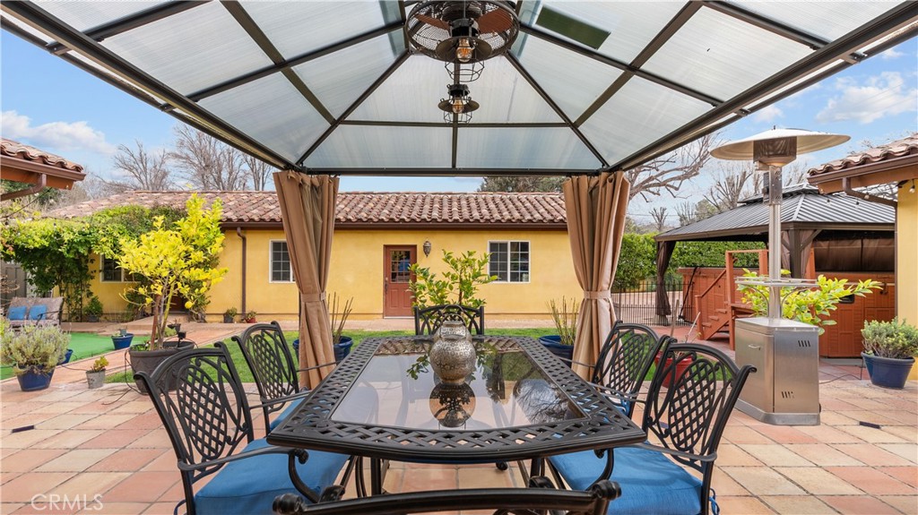 24604 Apple Street Newhall, CA 91321 - Photo 40 of 47 a view of a dining room with furniture window and outside view