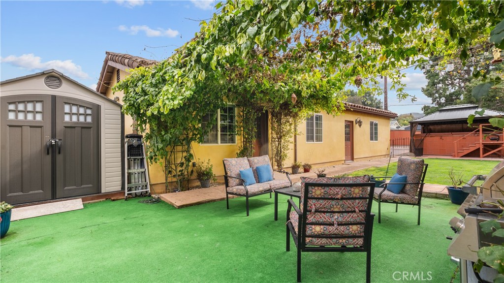 24604 Apple Street Newhall, CA 91321 - Photo 41 of 47 a front view of a house with garden