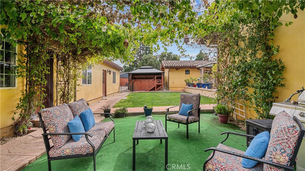 24604 Apple Street Newhall, CA 91321 - Photo 42 of 47 a view of a chair and table in backyard of the house