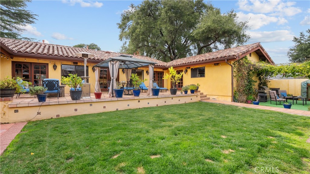 24604 Apple Street Newhall, CA 91321 - Photo 43 of 47 a view of a house with a patio
