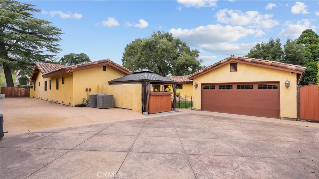 24604 Apple Street Newhall, CA 91321 - Photo 44 of 47 a front view of a house with a yard and garage
