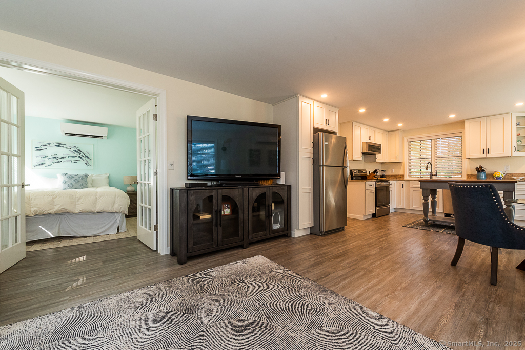 11 North Main Street Essex, CT 06426 - Photo 16 of 35 a living room with furniture and a flat screen tv