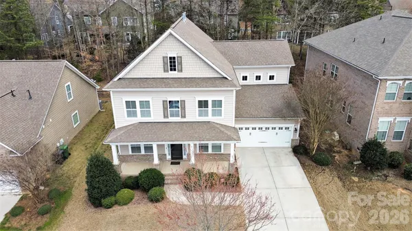 a aerial view of a house with a yard