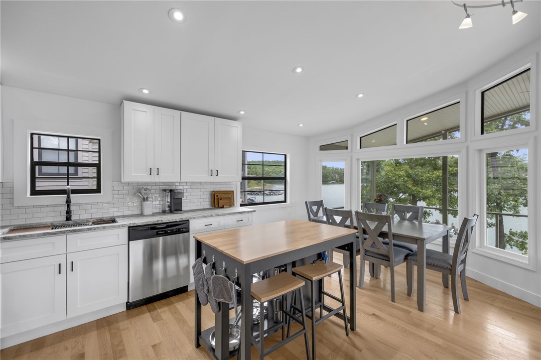 1230 Melton Road, Unit 30 West Union, SC 29696 - Photo 10 of 42 A lakeside kitchen offers ample workspace and bright dining with panoramic outdoor views.