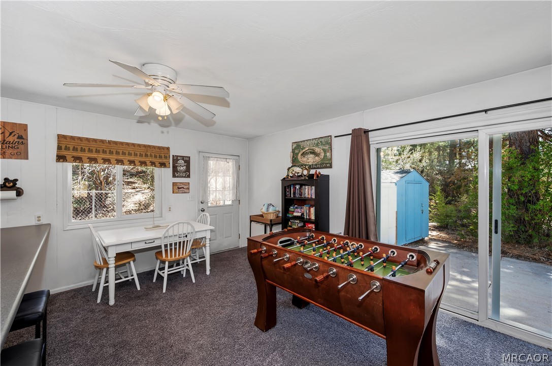 1099 Canyon Road Fawnskin, CA 92333 - Photo 16 of 39 a bed room with a bed and a chair